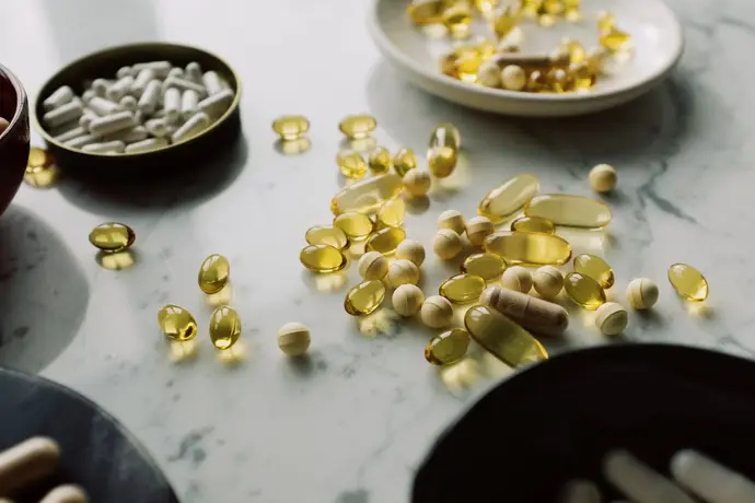 Assorted liver health supplements and pills on a surface