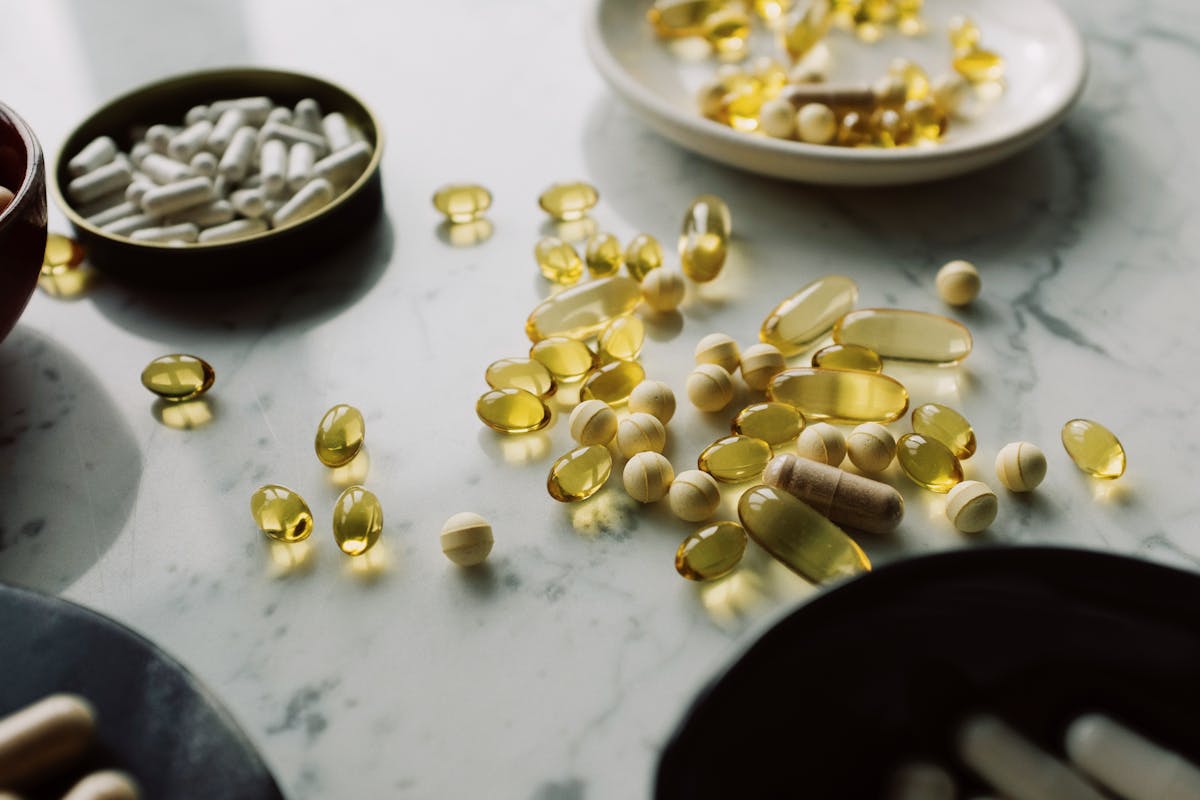 Assorted liver health supplements and pills on a surface