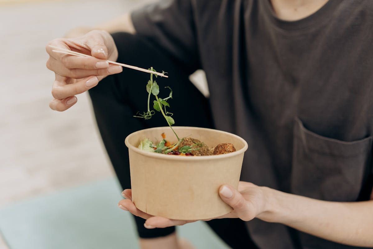 Woman choosing healthy foods as natural appetite suppressant