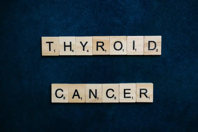 Woman holding natural thyroid support supplements